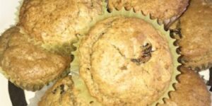 Muffins on a decorative horse-themed plate.