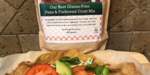 A fresh vegetable salad with tomatoes, cucumbers, and herbs.